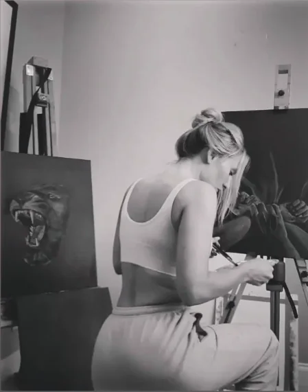 Melanie Hughes working on a painting in her Leeds studio.